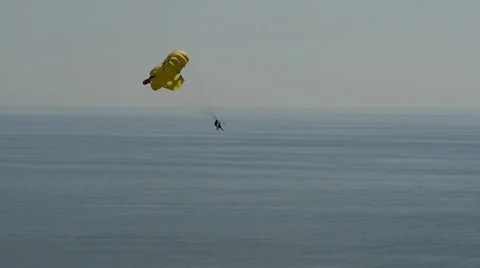 Man paragliding over the ocean Stock-Footage 58114768