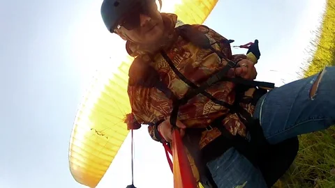 Man paragliding take off on a hill. Three in one video HD. Stock Footage 72154683