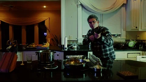 Man paranoid with a gun inside Stock Footage 99499782
