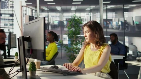 Man with paraplegia drinking coffee, checking progress done by employee Stock Footage 318161062