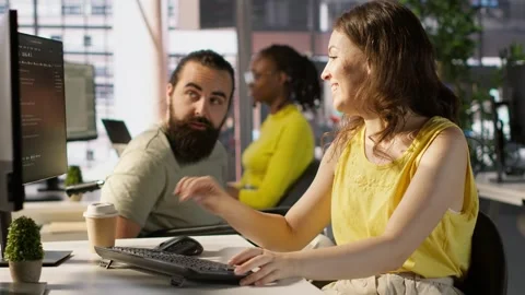 Man with paraplegia drinking coffee, checking progress done by employee Stock Footage 318231489