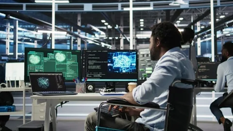 Man with paraplegia in server hub trying to protect hardware from hacker attack Stock Footage 309509570