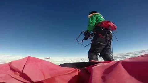 Man parasailing across the snow Stock Footage 79978657