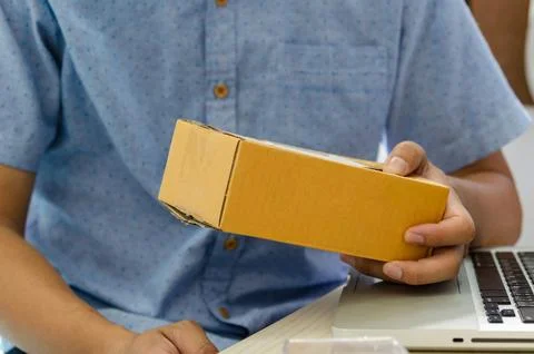 Man with a parcel box Stock Photos