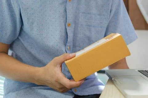 Man with a parcel box Stock Photos