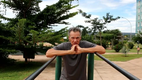 Man at Park with Parallel Bars Stock Footage 168906183