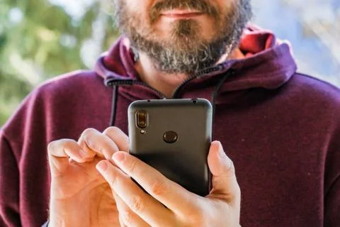 Man at park using smart phone Stock Photos