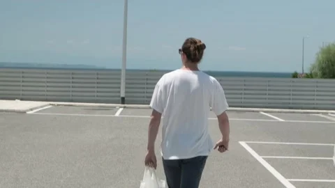 Man at parking lot. Stock Footage 200008323