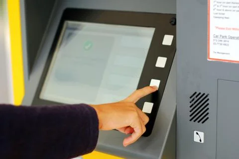 Man at parking ticket machine Stock Photos