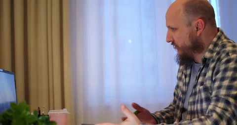 Man participating in virtual meetings with colleagues and family, connection Stock Footage 301525988