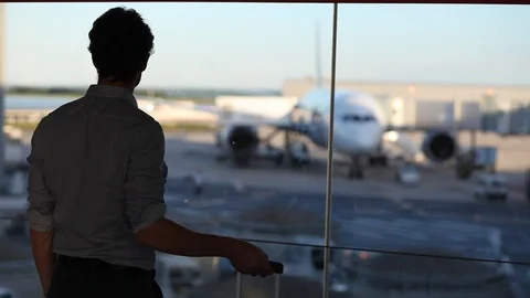 Man passenger using mobile phone smartphone in airport Stock Footage 96127257