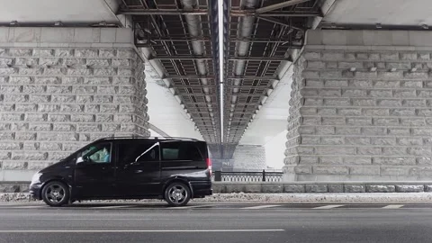 Man passes in black car which rides backward by Stock Footage 299678715
