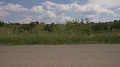 A man passes in the frame on the road on the longboard. Extreme longboard riding Stock Footage 111304747