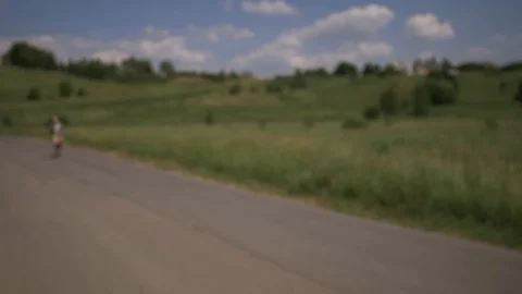 A man passes in the frame on the road on the longboard. Extreme longboard riding Video stock 111306431