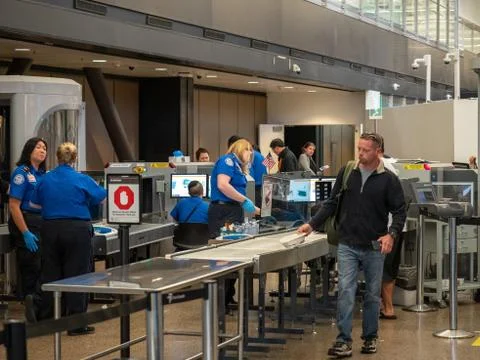 Man passes though Transportation Security Administration TSA security checkpoint Stock Photos