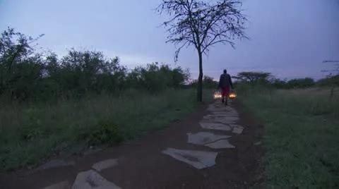 Man passing with lamps Stock Footage 12658046