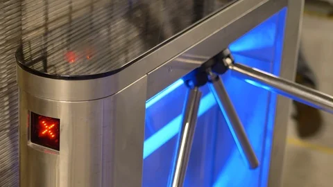 Man passing through a modern turnstile in an industrial automotive factory 動画素材 124605537