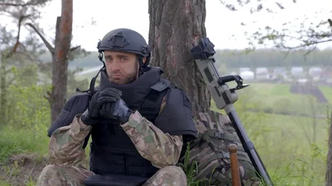 A man pauses in the work of demining the territory Stock Footage 297887106