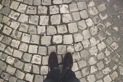 Man on the pavement Stock Photos