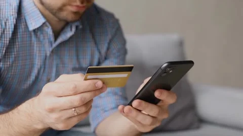 A man paying bill online using smart phone Vídeo Stock 247353521