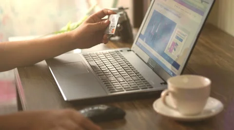 A man paying for online shopping using laptop and credit card. Stock Footage 60942824