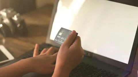 A man paying for online shopping using laptop and credit card. Stock Footage 60943564