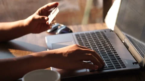 A man paying for online shopping using laptop and credit card. Stock Footage 61111287