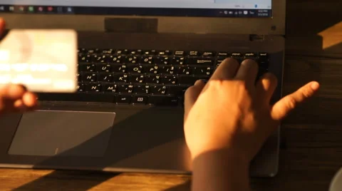 A man paying for online shopping using laptop and credit card. Stock Footage 61111796