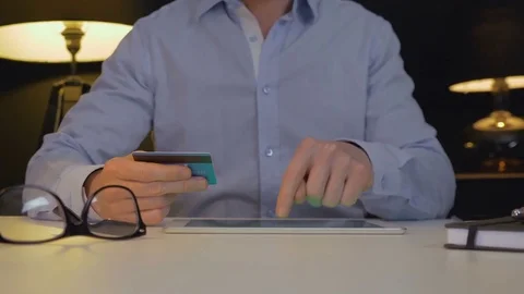 Man paying online with tablet Stock Footage 84333905
