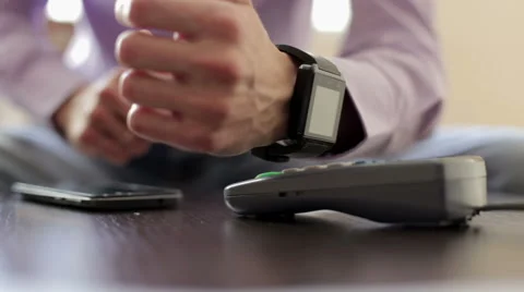 Man is Paying with a Smart Watch Video stock 68938702