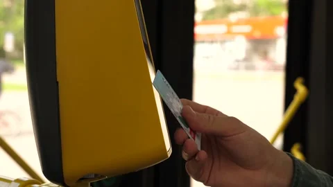 A man pays for a bus ride using his card Stock Footage 138874481