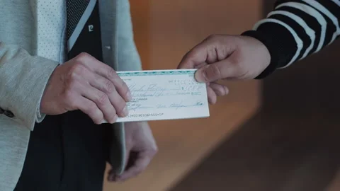 Man pays by check for services Stock Footage 154955253