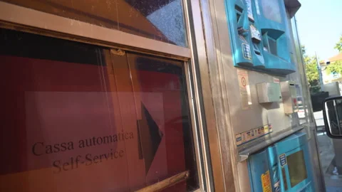 Man pays a fee in self-service automat for the toll road in Italy - 4K, Handheld Stock Footage 166936743