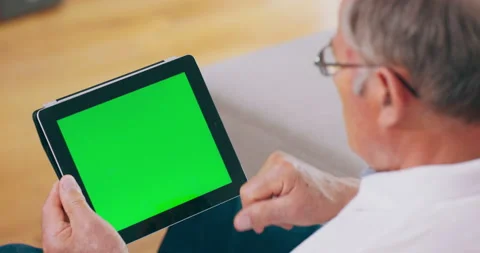 A man pays online using his tablet computer. Stockbeeldmateriaal 144922849