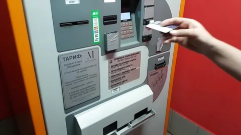 Man pays for parking by cash in the machine Stock Footage
