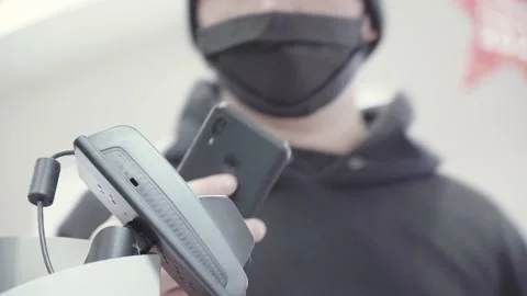 Man pays for purchases using a smartphone at the POS terminal Video stock 166105337