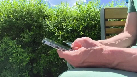 Man pays with smartphone outdoors. Mobile wallet tap progresses to card tra.. Stock Footage 337171982