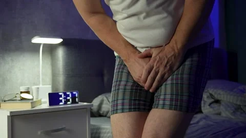 Man Pee His Pants, close-up. A man suffering from pain in the pelvic organs.. 動画素材 293197155