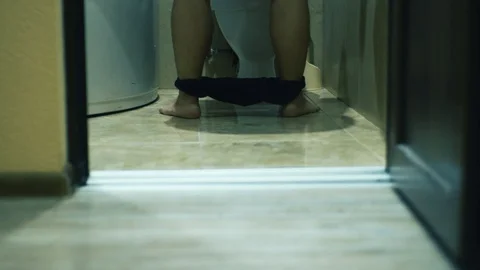 A man peed, dressed panties and leaves the toilet_door opened Video stock 120287964