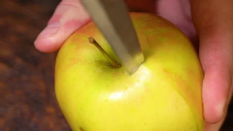 Man peeling an apple in the kitchen Stock Footage 250014650