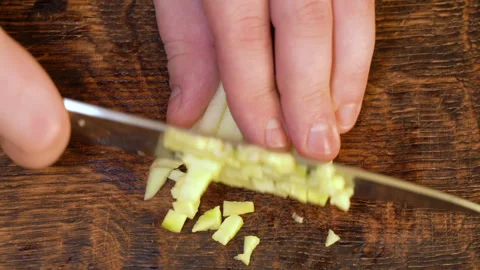 Man peeling an apple in the kitchen Stockbeeldmateriaal 251451342
