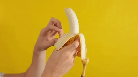 Man Peeling Bananna Stock Footage