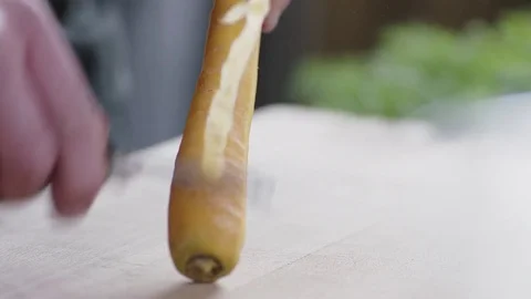 Man is peeling a carrot Stock Footage 78033253