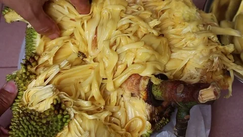 The man is peeling fruit Stock Footage 78250232