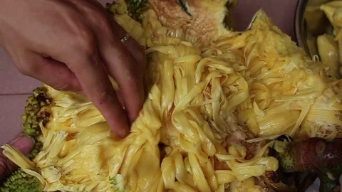 The man is peeling fruit Stock Footage 78250242
