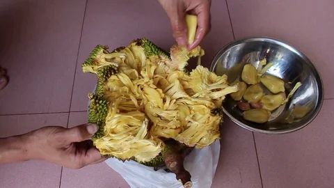 The man is peeling fruit Stock Footage 78250276
