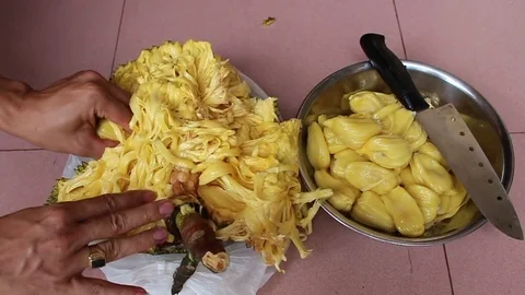 The man is peeling fruit Stock Footage 78250332