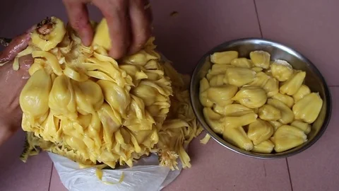 The man is peeling fruit Stock Footage 78250563