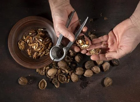 Man peeling nuts 写真素材
