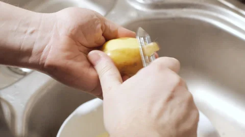 Man peeling potato Stock-Footage 35478591